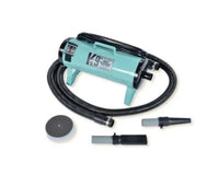 Turquoise air compressor with attachments on a white background